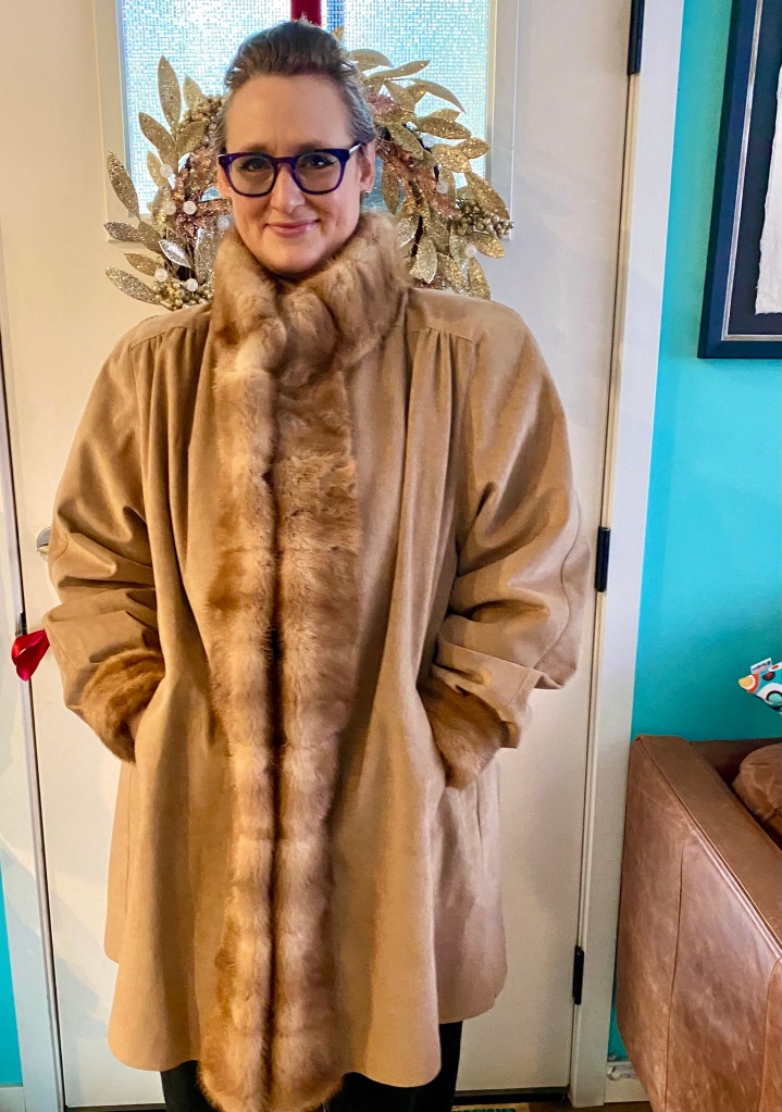 A woman in a fur coat thinking she has zero more fucks to give about what anyone things. 